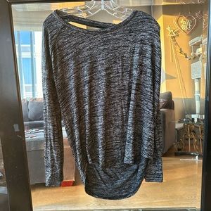 Soft loose fitting tight shoulder top